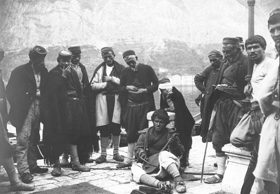 Lantern slide of native minstrel in Kotor, playing the gusle